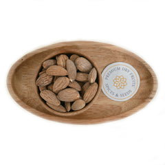 Salted almonds are typically roasted almonds that have been seasoned with salt, enhancing their flavor. 