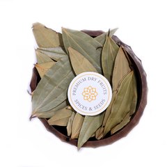 A bowl filled with dried bay leaves, sold by House of Rasda.