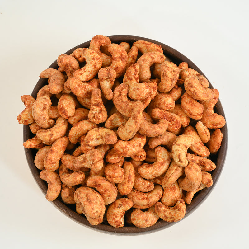 Our Fastest and Bestselling Indian Masala Flavour of cashew nuts covered in red chilly powder called Cashew Nuts Red Chilli Spiced