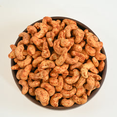 Our Fastest and Bestselling Indian Masala Flavour of cashew nuts covered in red chilly powder called Cashew Nuts Red Chilli Spiced