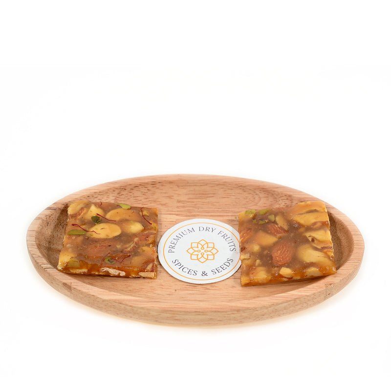 It is often enjoyed as a healthy snack due to its rich nutrient content and is free from preservatives and artificial colors Dry Fruit Chikki.