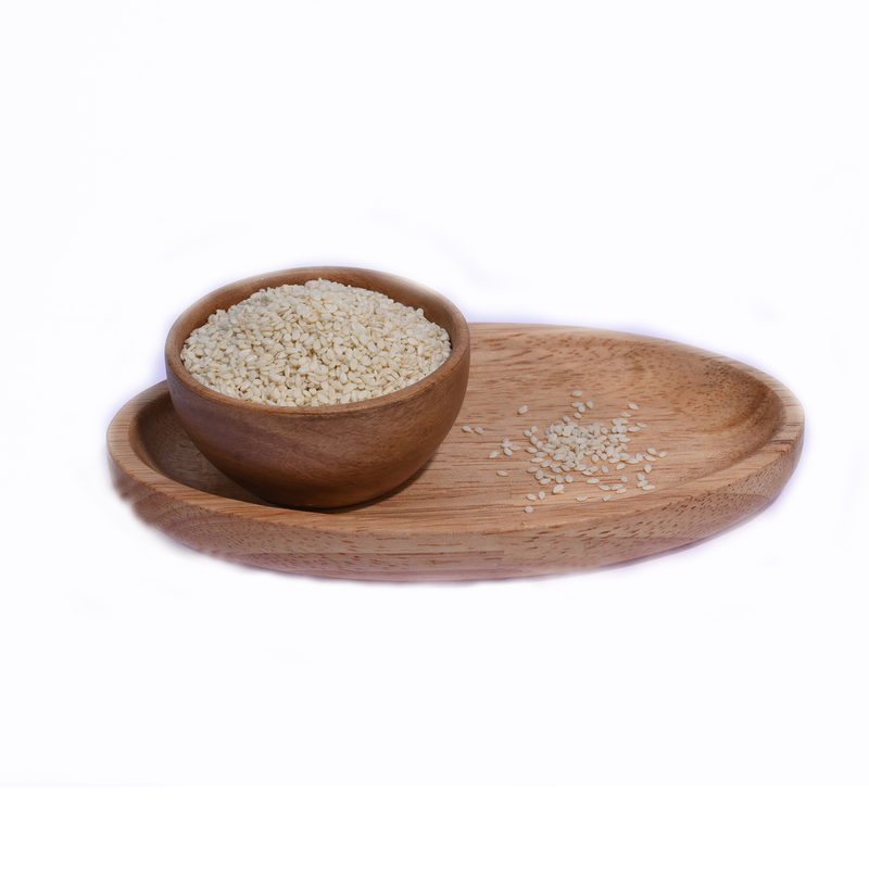 A wooden bowl filled with White Sesame Seeds Nylon