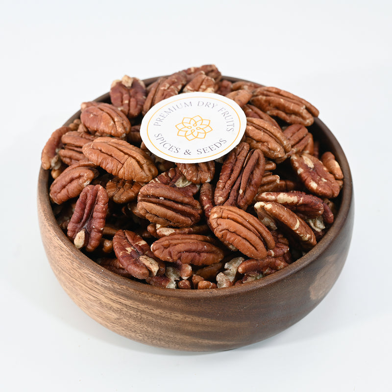 Premium Exotic Pecan Nut has a distinctively rich flavor with a slightly sweet taste. Its texture is crunchy when raw and chewy when roasted. The nut has a brownish color and an oval shape, making it a great addition to many recipes.