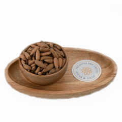 a pile of brown unshelled Exotic pine nuts, Pine nuts with shell, also known as exotic Chilgoza.