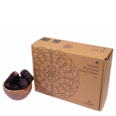 Natural Safawi dates shown in the cup along with the Packaging Box.