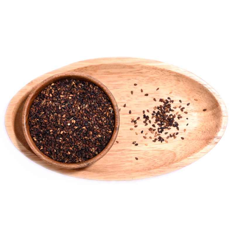 Black sesame seeds sprinkled over a salad, adding contrast and texture.