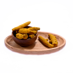 Turmeric sticks with a rough, wrinkled texture, showcasing their deep yellow hue against a neutral background